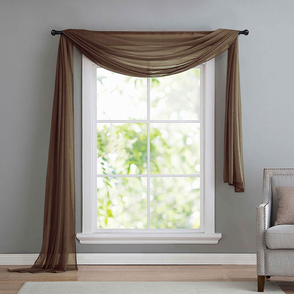 A sheer brown scarf-like curtain draped over a window.