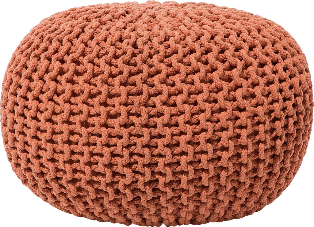 A round, knitted pouf in a copper/orange color against a white background.
