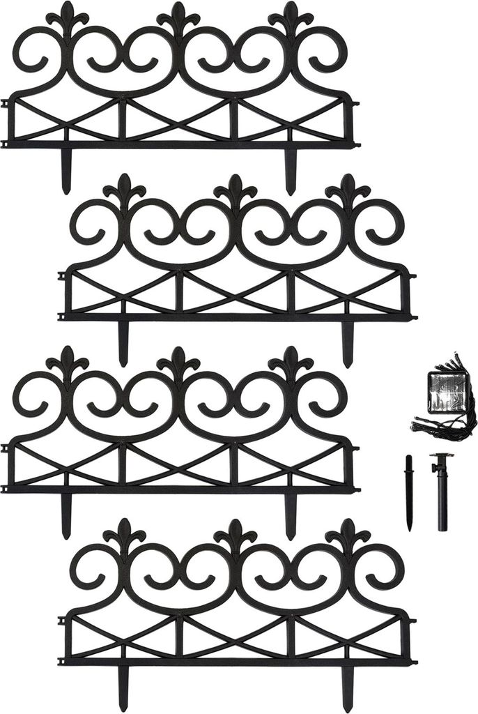 Four black decorative fence sections are arranged in a stack, with some small accessories to the right.