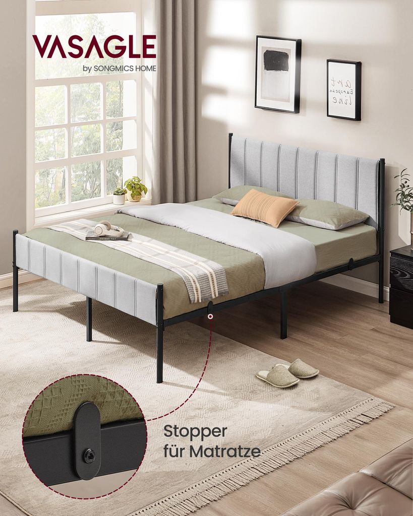 A bedroom scene with a bed, rug, and window.