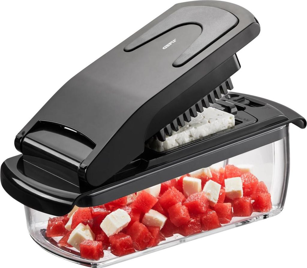 A black and clear food dicer with diced watermelon and cheese in a clear container.