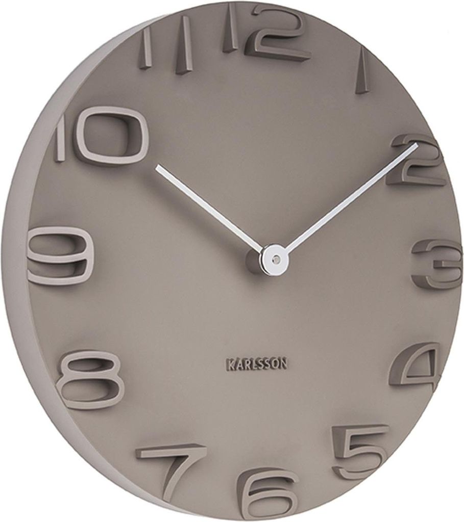 A close-up, angled view of a Karlsson wall clock.