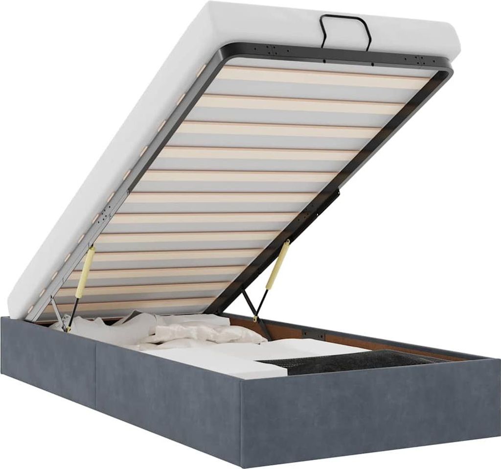 A bed frame with the mattress lifted, revealing storage space underneath.
