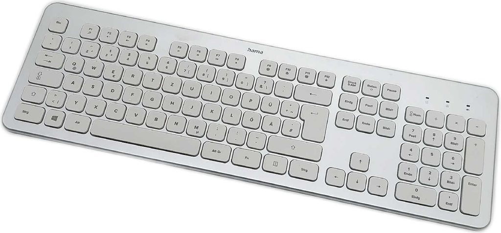 A silver and white wireless keyboard is shown from a slightly elevated angle against a white background.