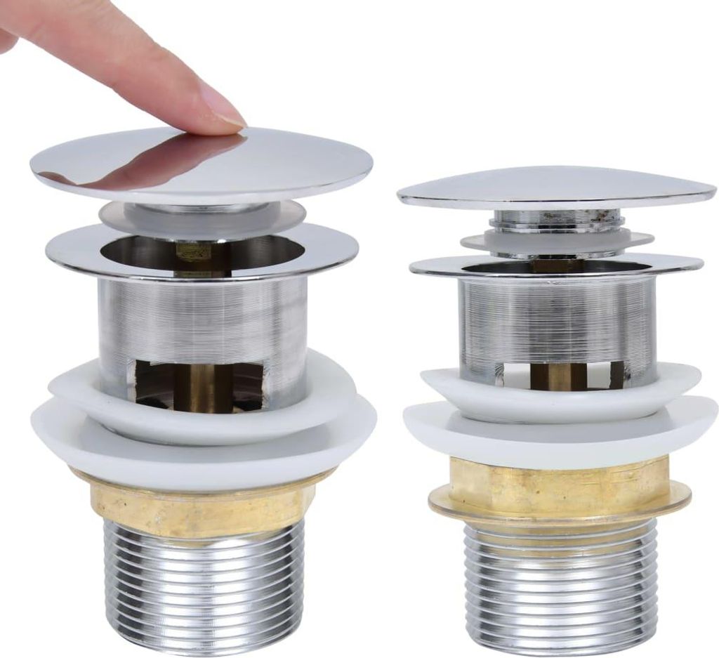 Two chrome pop-up drain assemblies are shown against a white background, with a finger pressing down on the top of one.