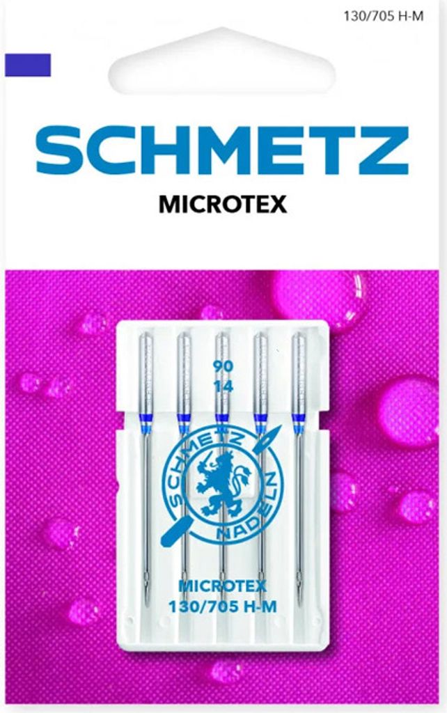 A package of Schmetz Microtex sewing machine needles against a pink textured background with water droplets.