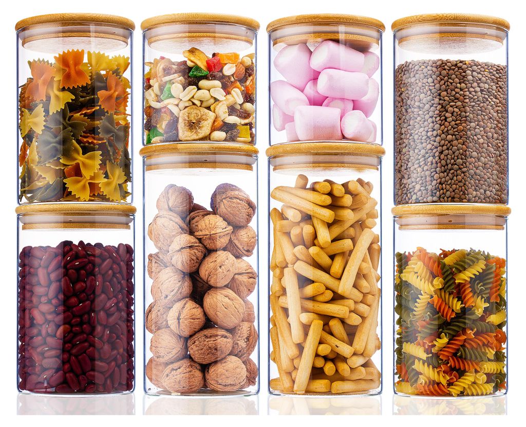 A collection of glass jars filled with various food items, arranged in two rows.