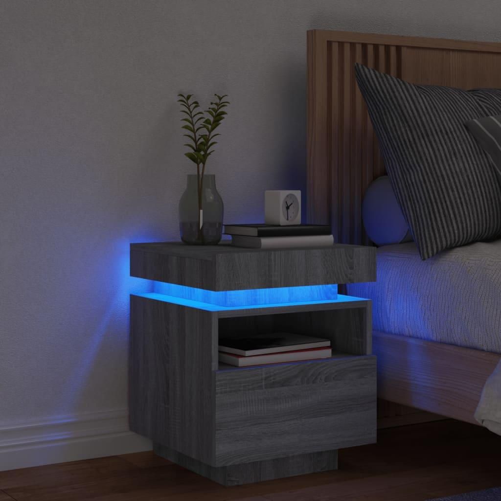 A modern bedside table with LED lighting in a bedroom setting.