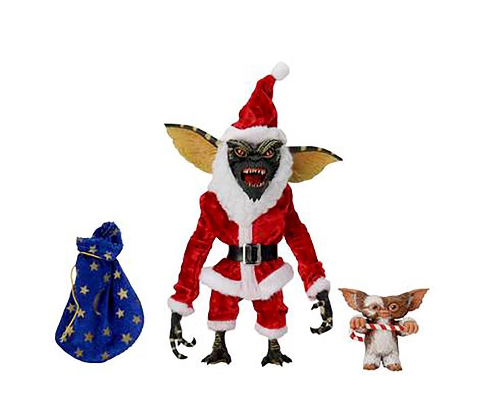Three Gremlins figures, one dressed as Santa Claus, with a gift bag, on a white background.