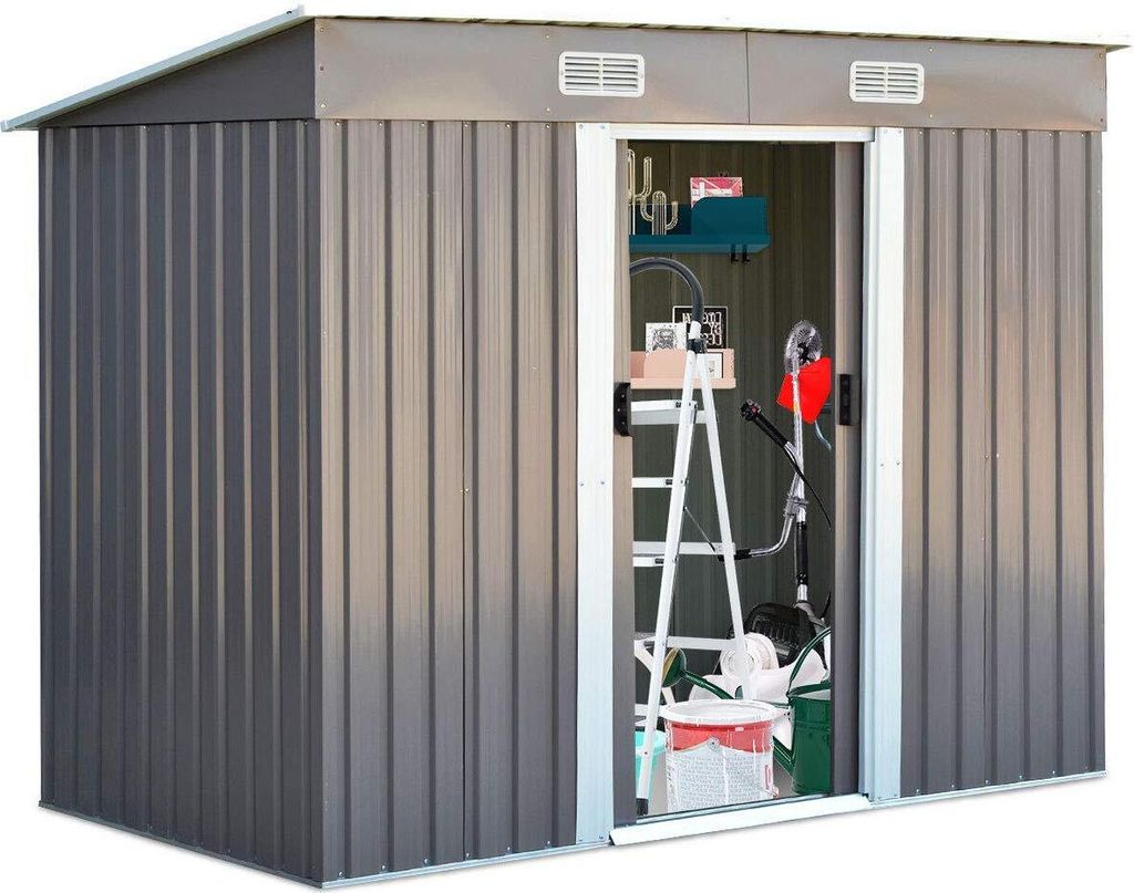 A metal garden shed with its door open, revealing stored tools and equipment.