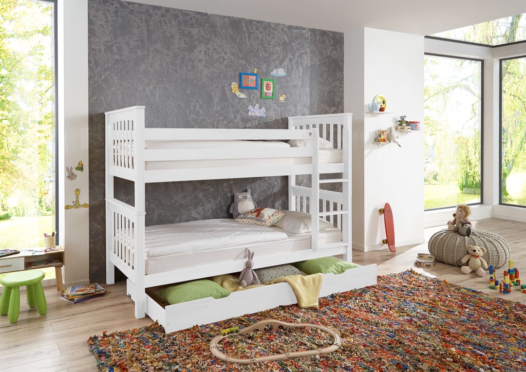 A children's bedroom with a white bunk bed, toys, and a colorful rug.