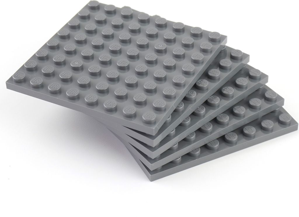 A stack of five dark gray LEGO baseplates.