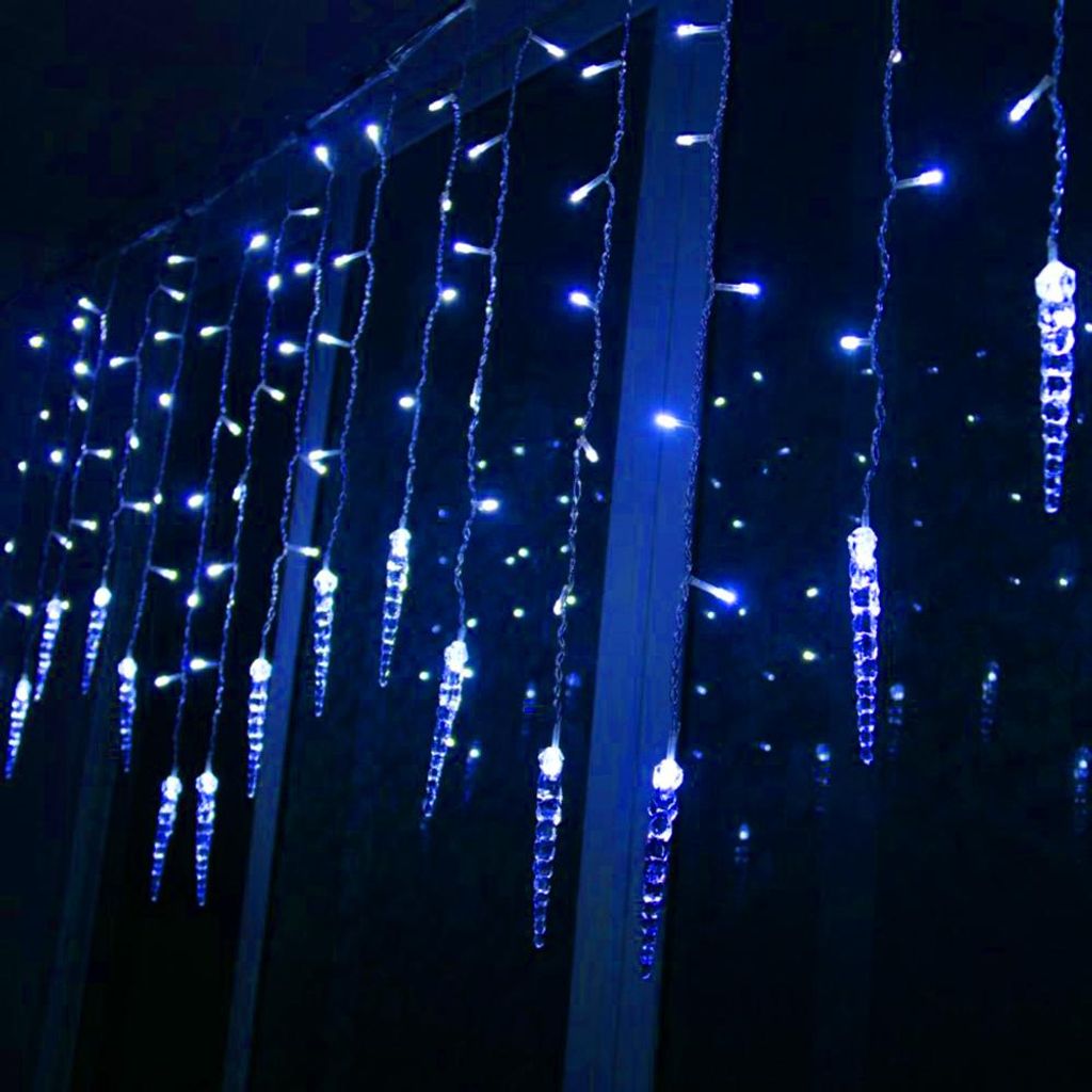 Blue icicle-shaped string lights hanging in the dark.