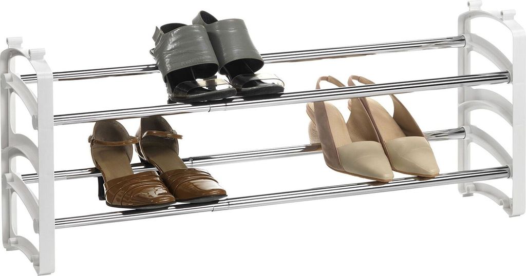 A three-tiered shoe rack with various shoes displayed on each level against a white background.