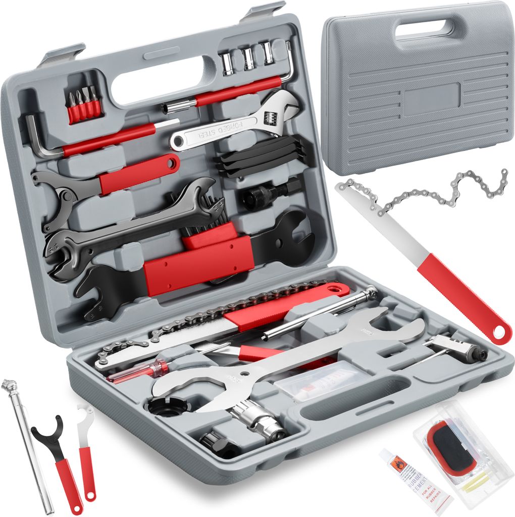 A bicycle tool kit laid out in its case, with some tools outside the case.