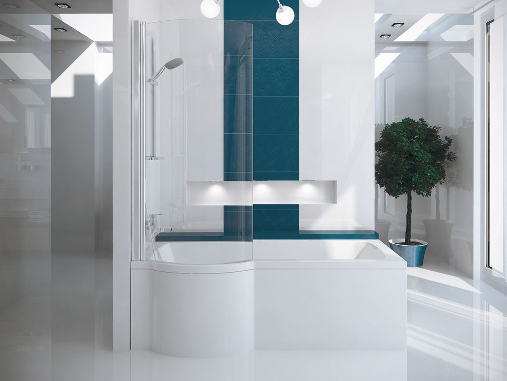 A modern, minimalist bathroom featuring a white bathtub with a glass shower enclosure and teal tiles.