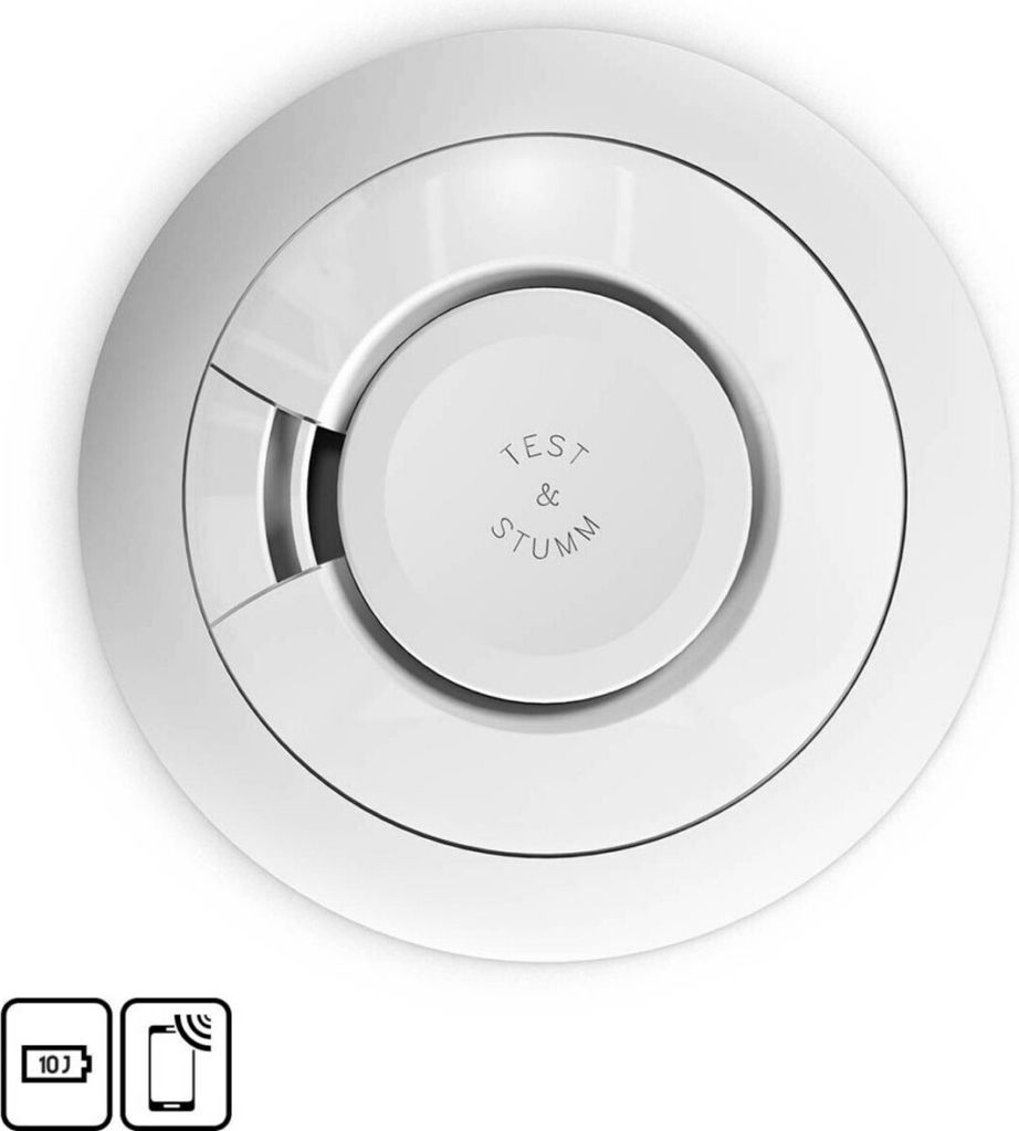 A top-down view of a white smoke detector with 'TEST & STUMM' text in the center.