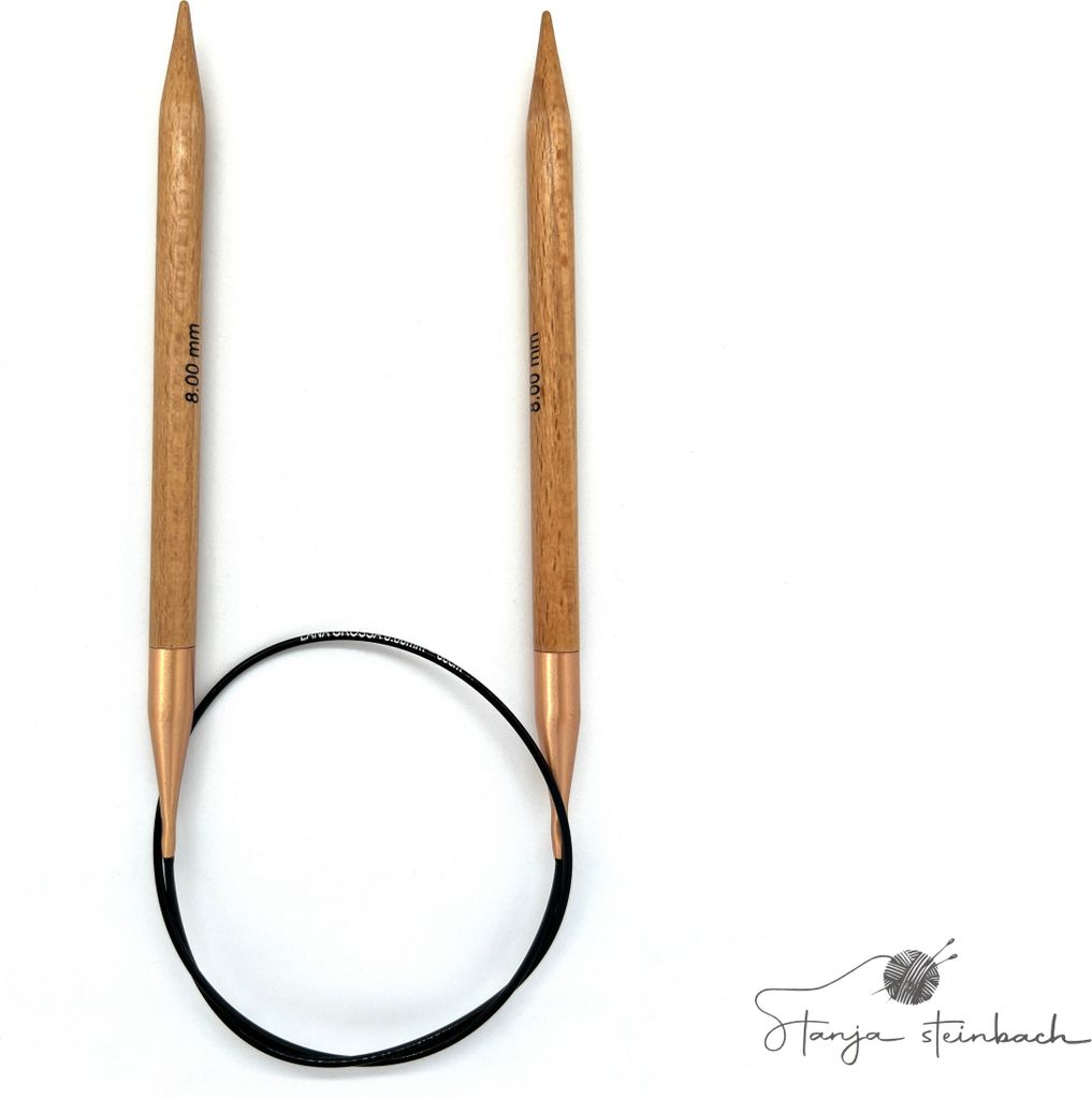 A pair of circular knitting needles with a black cable, presented on a white background.