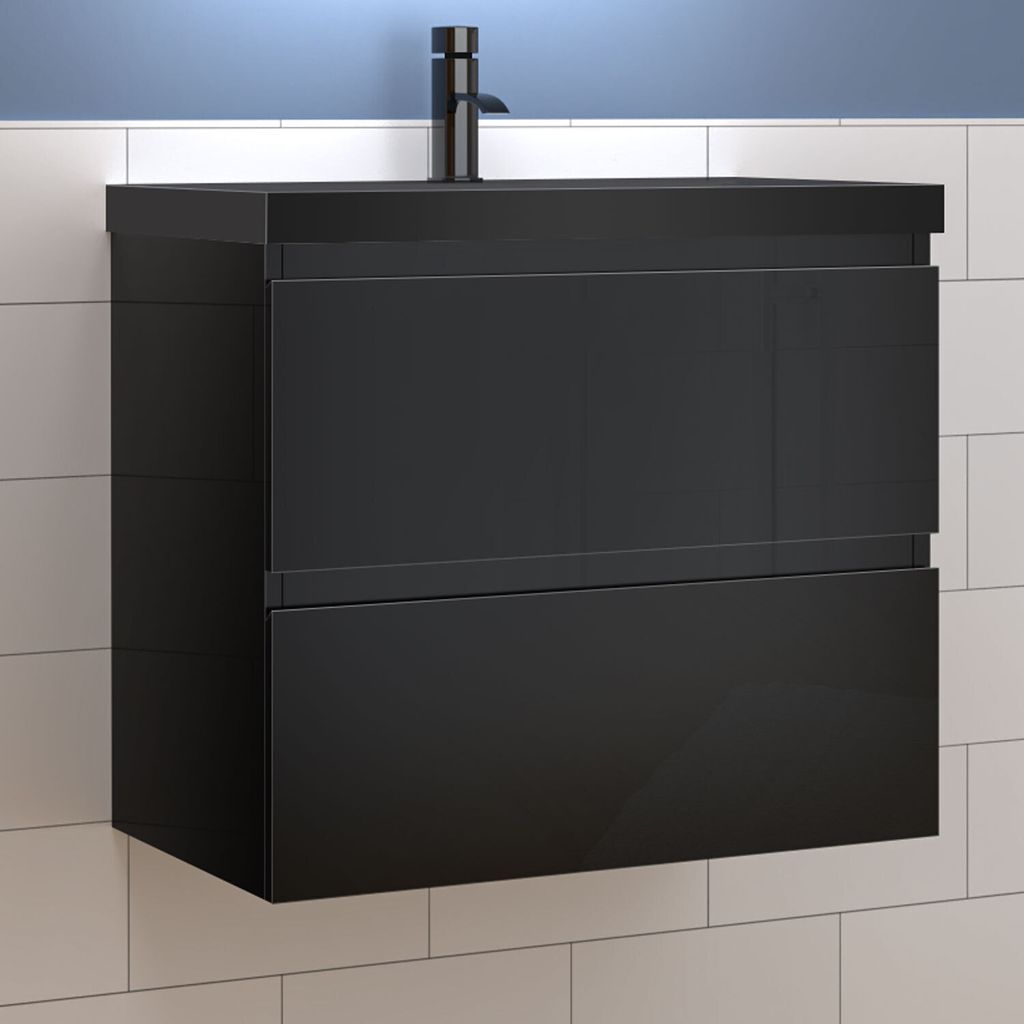 A black bathroom vanity with a modern faucet is mounted on a tiled wall.