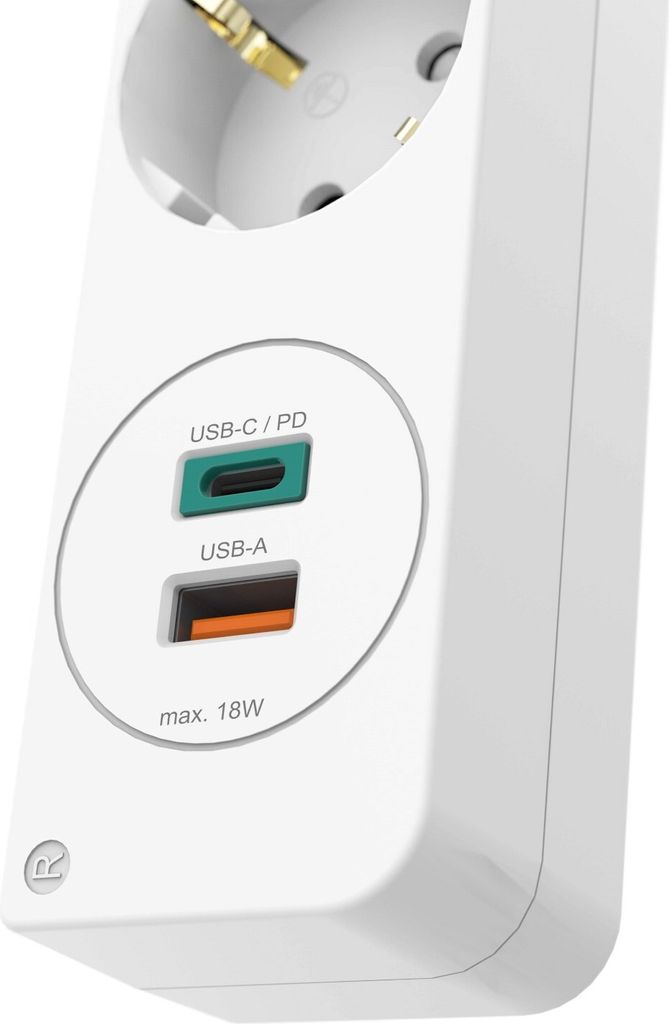 A close-up shot of a white power strip with USB ports.