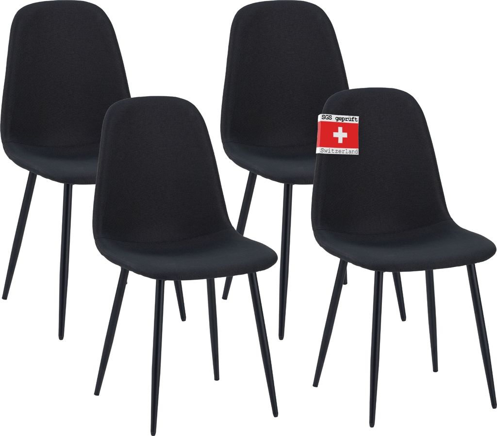 A set of four black dining chairs.