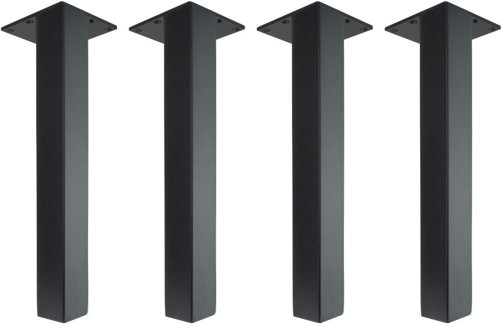 Four black table legs are arranged in a row against a white background.