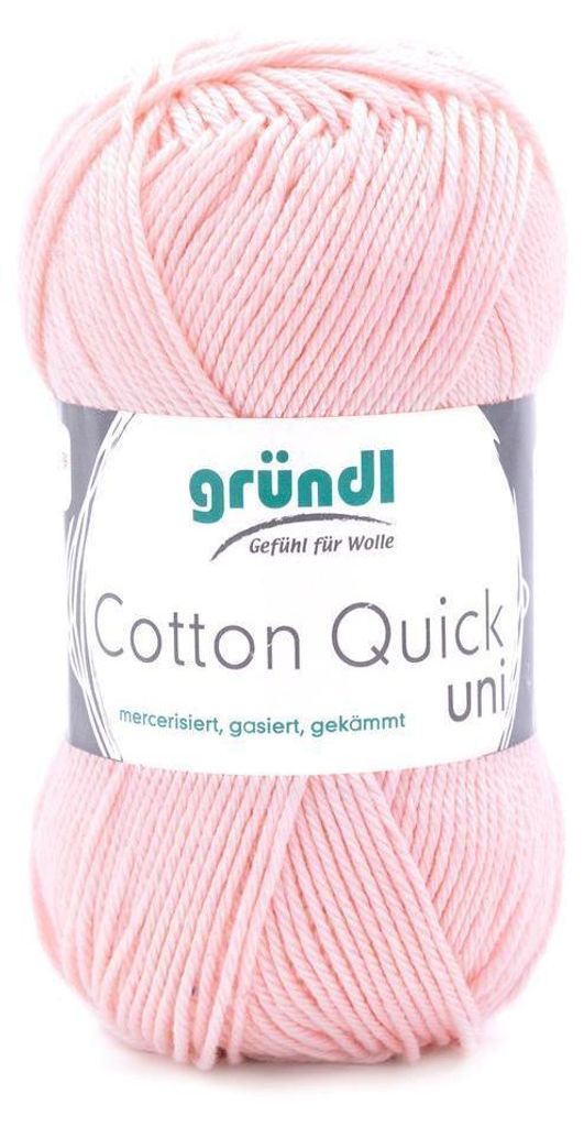 A ball of pink yarn with a label.