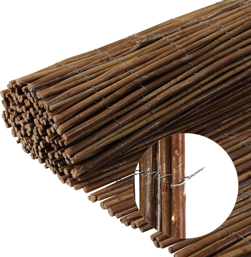 A close-up view of a rolled-up reed fence, showing the texture and binding.