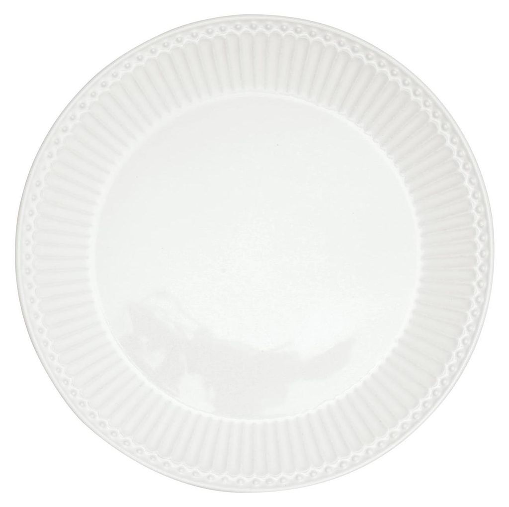 A white plate with a decorative rim.