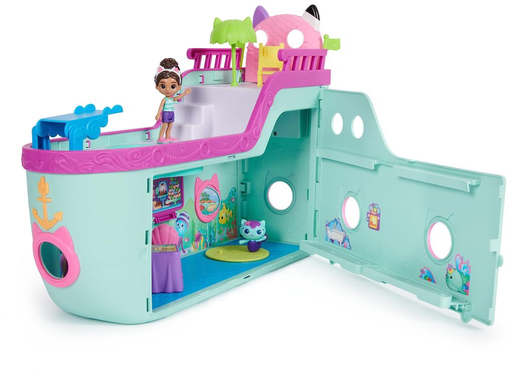 A toy cruise ship playset with figures.