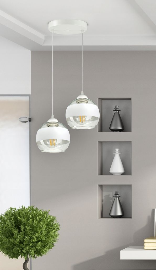 A modern interior scene with two pendant lights hanging from the ceiling, a decorative plant, and recessed shelves with decorative objects.