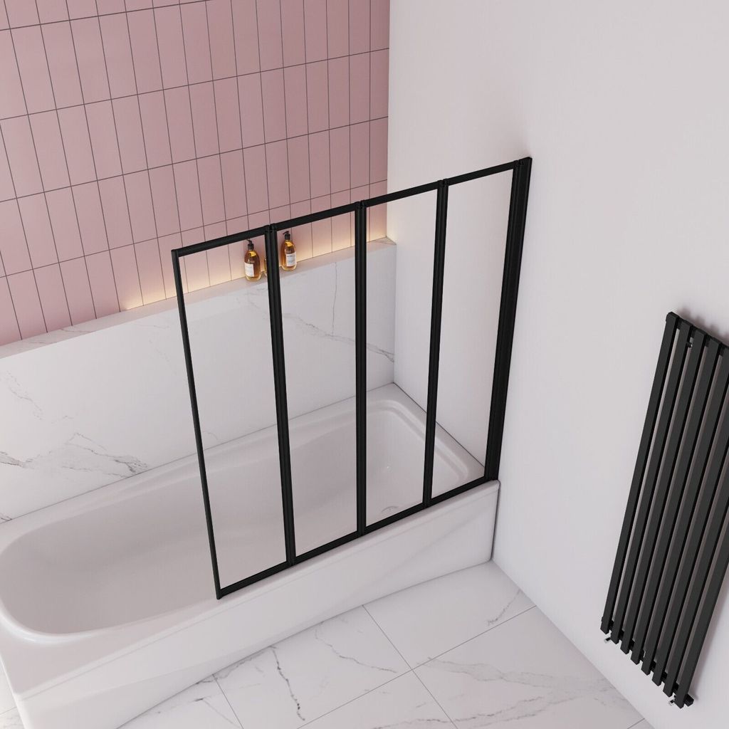 A modern bathroom with a bathtub and a shower screen.