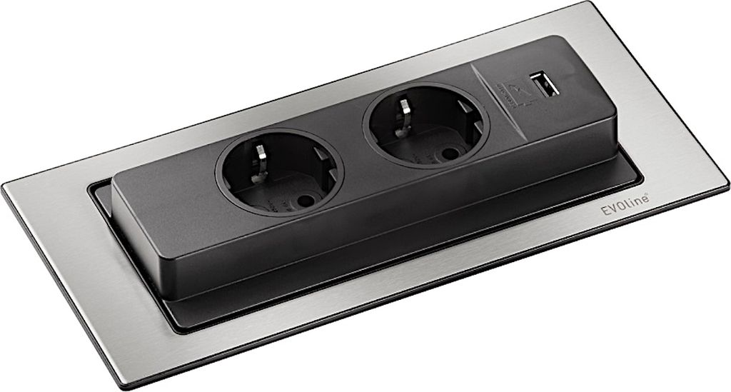 A close-up, studio shot of a retractable power outlet with two European-style sockets and a USB port, mounted on a brushed metal plate.