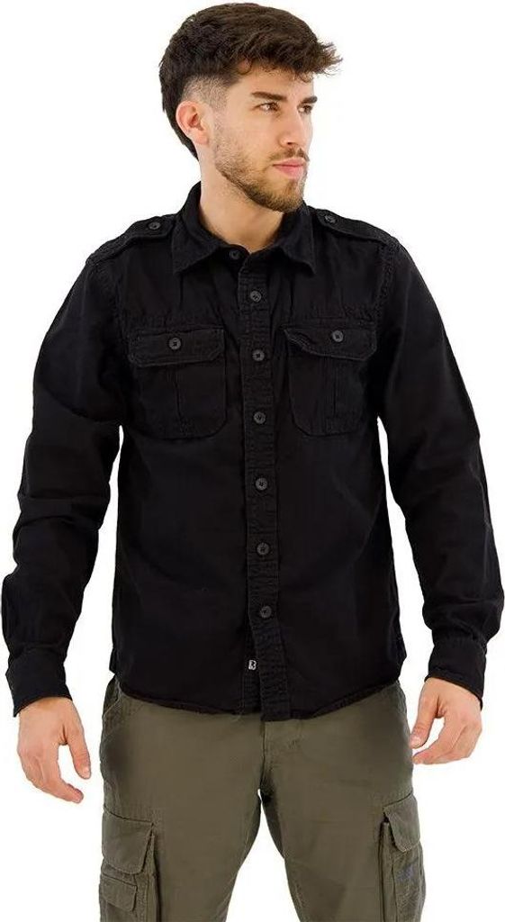 A man wearing a black shirt and green pants, posing for a product image.