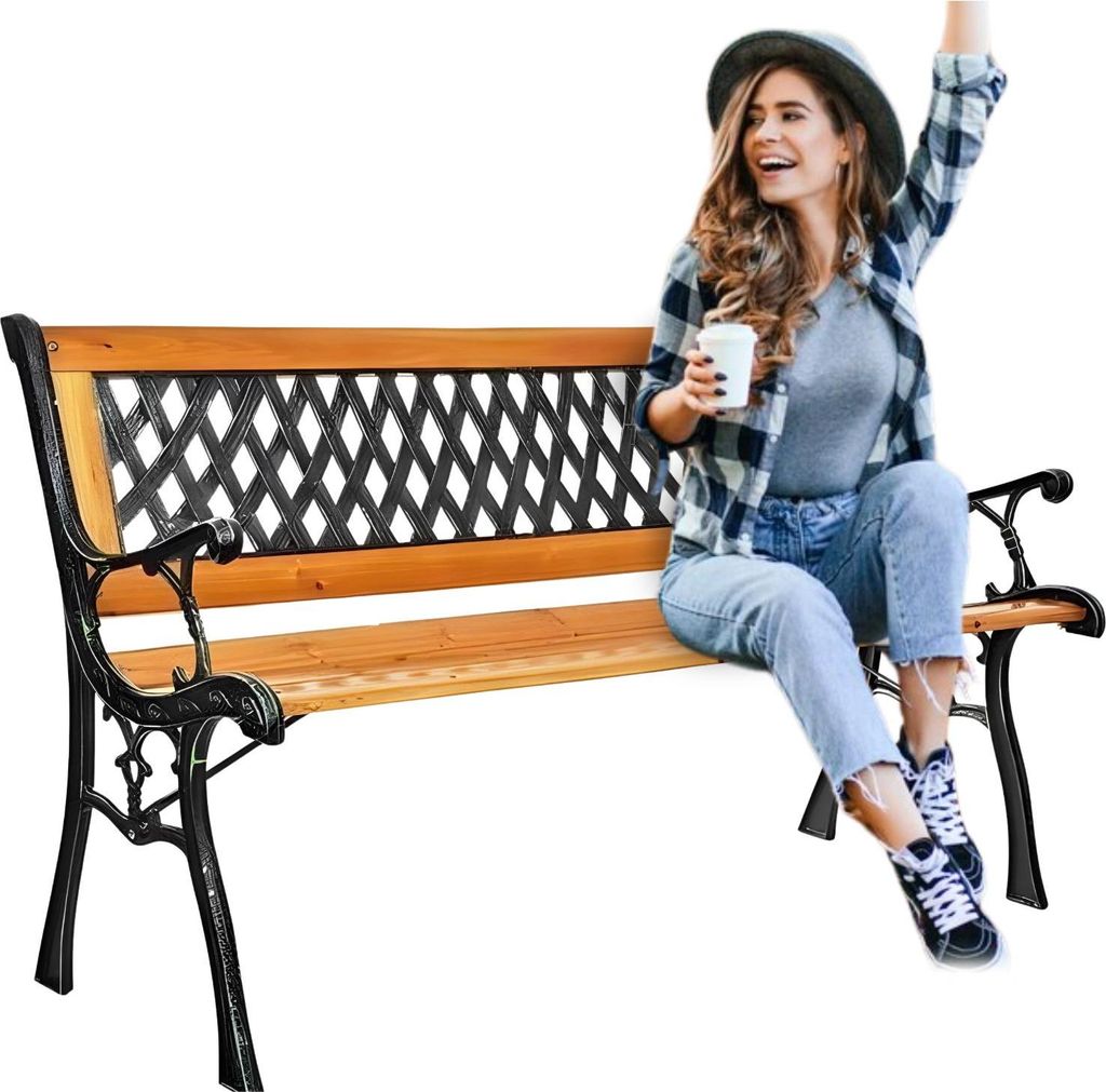 A woman sits on a wooden park bench, holding a cup and raising her arm in a celebratory gesture.