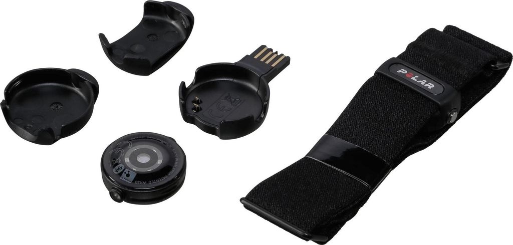 A collection of Polar OH1 optical heart rate sensor accessories, including a chest strap, charging clip, and mounting bases, laid out on a white background.