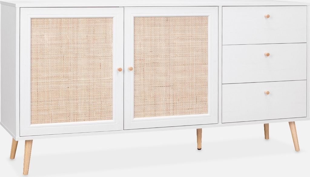 A white sideboard with two doors featuring rattan inserts and three drawers on the right side, all supported by wooden legs.