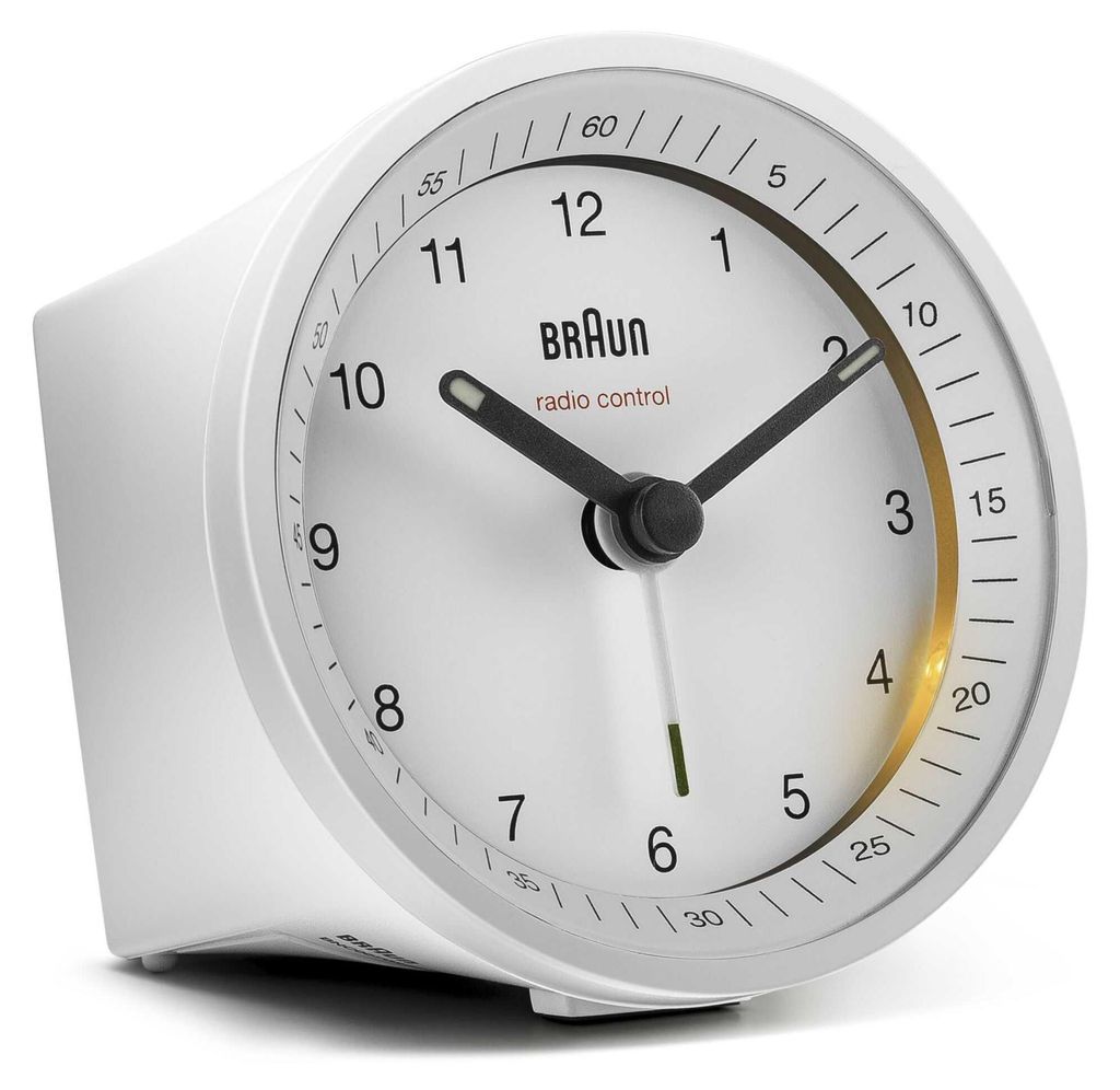 A white Braun radio-controlled alarm clock is shown against a white background.