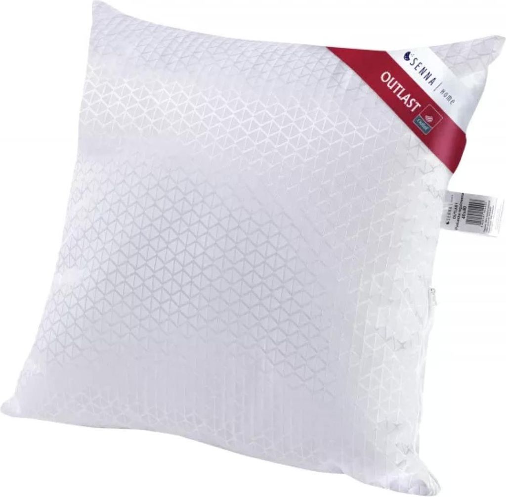 A white pillow with a patterned texture and a red tag attached to the corner.