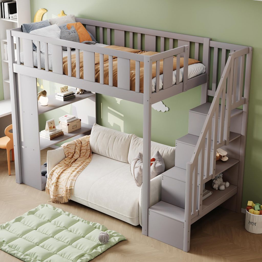 A child's loft bed with a sofa underneath, set up in a room with light green walls and a wooden floor.