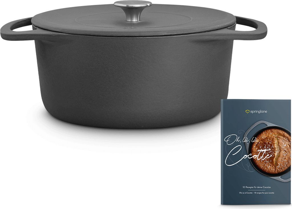 A gray cast iron Dutch oven with a lid and a cookbook are displayed on a white background.