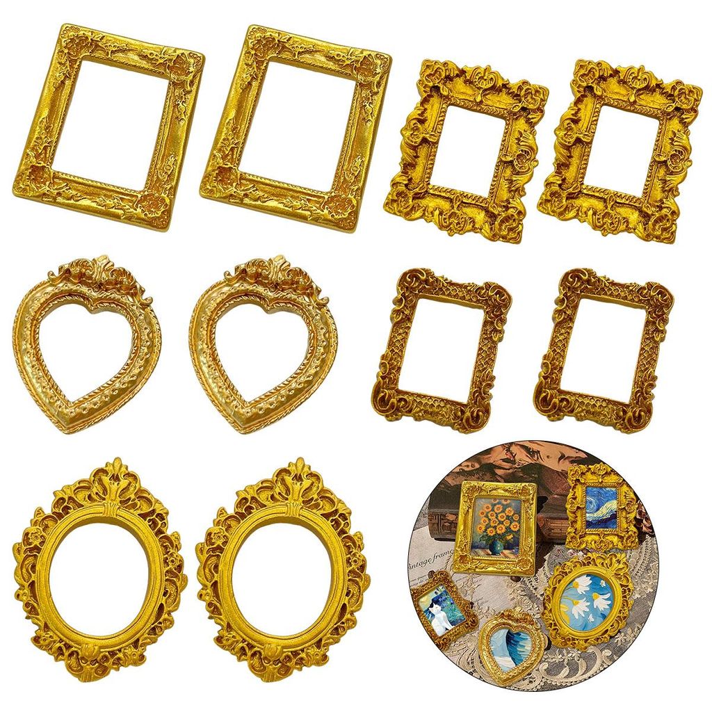 A collection of ornate, vintage-style picture frames arranged on a white background.