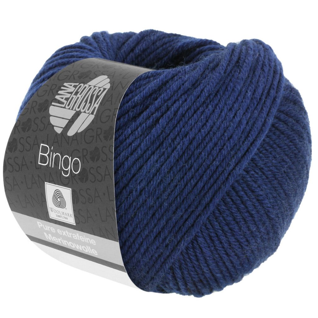 A ball of dark blue yarn with a label wrapped around it.