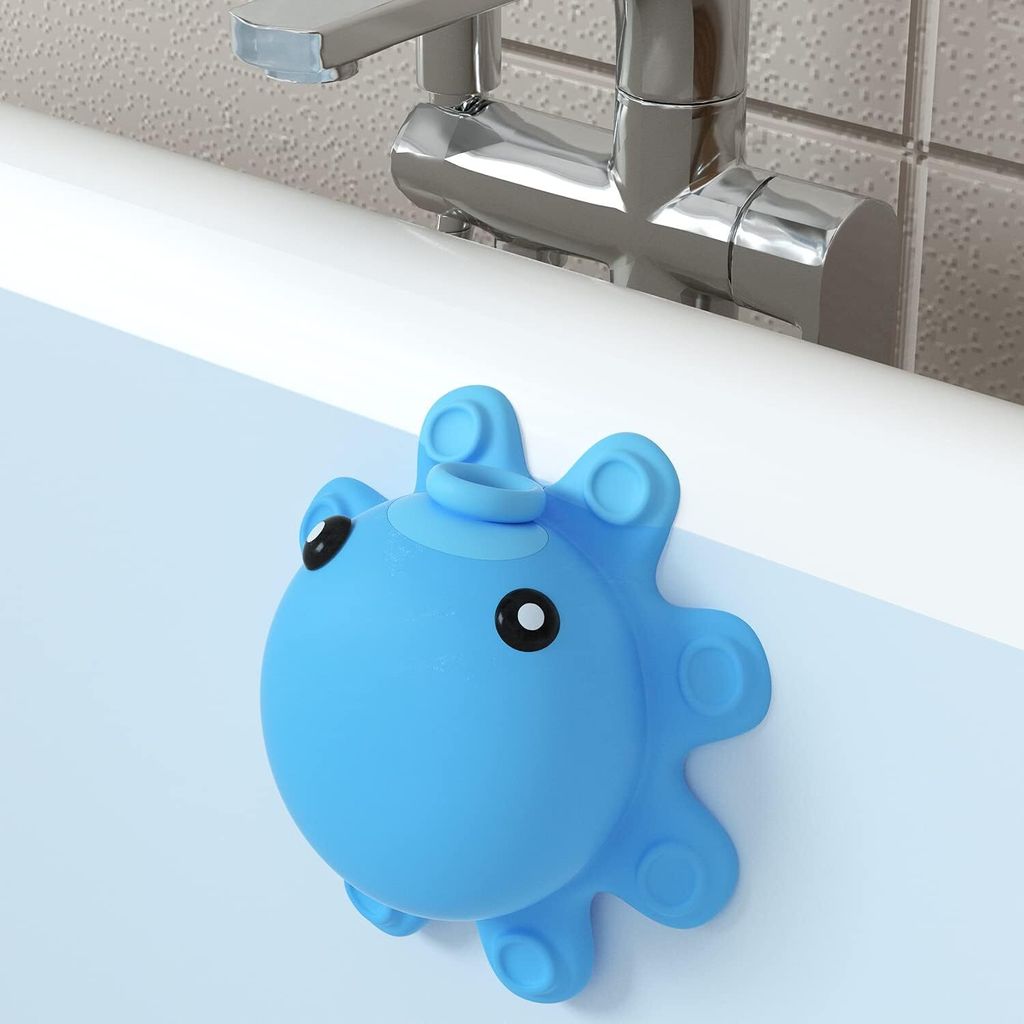 A blue octopus-shaped bathtub overflow drain cover is attached to the side of a bathtub, with a faucet visible in the background.