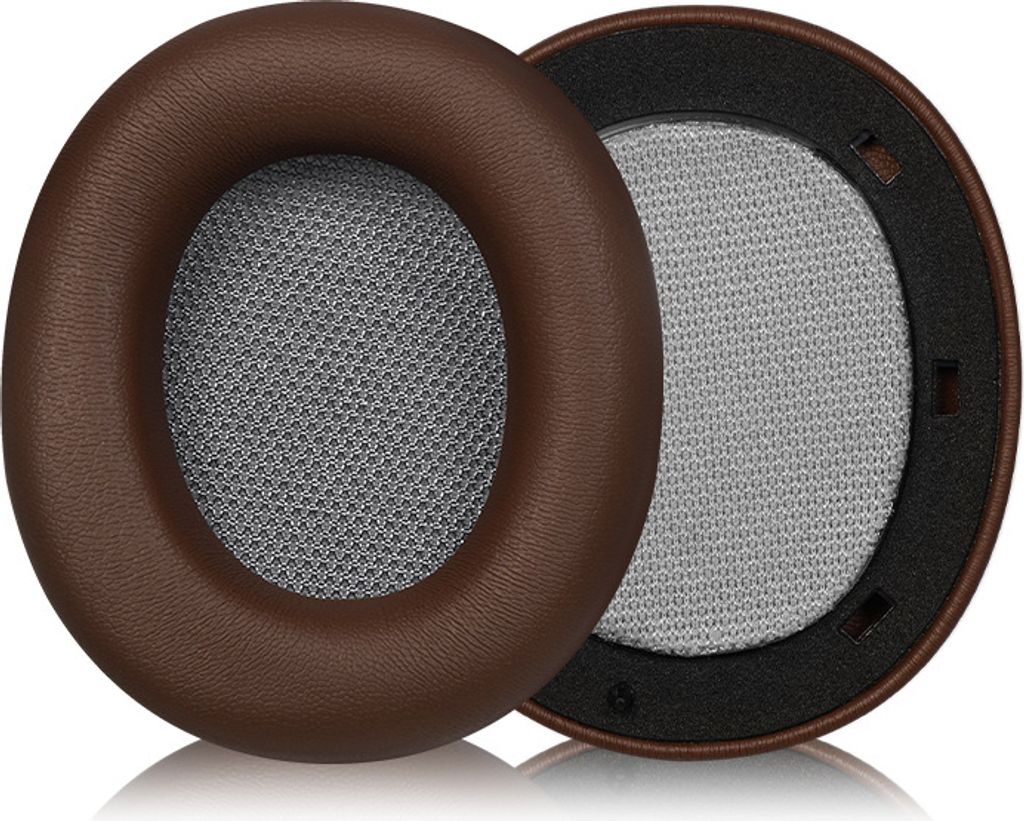 Two brown headphone ear pads with gray mesh inserts are shown on a white background.