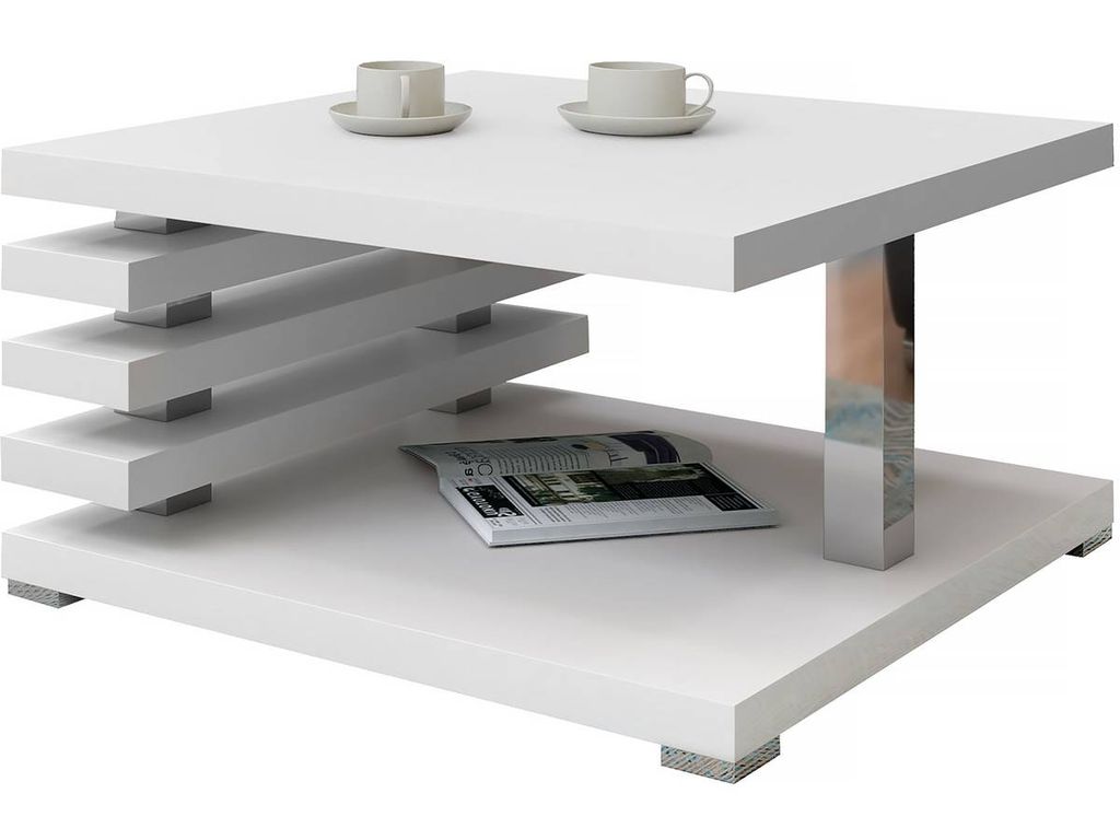 A white coffee table with a modern design, featuring two shelves and a chrome leg. Two coffee cups and saucers are on the top shelf, and a magazine is on the lower shelf.