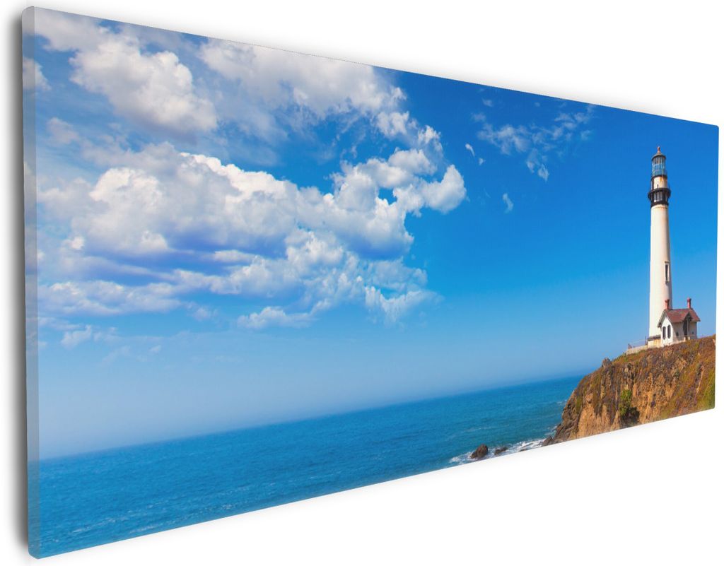 Wallario Premium Leinwandbild Leuchtturm auf einem Felsvorsprung - Blauer Himmel in Größe 30 x 75 cm