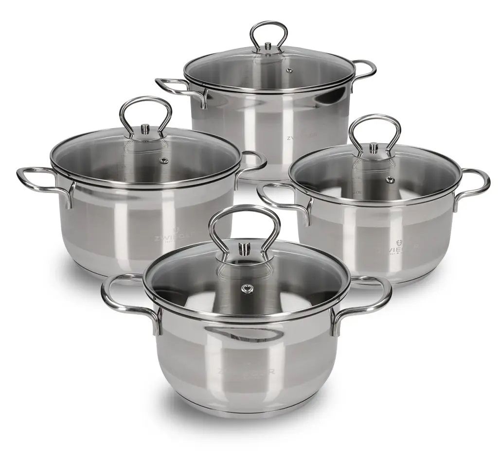 A set of four stainless steel pots with glass lids, arranged diagonally on a white background.