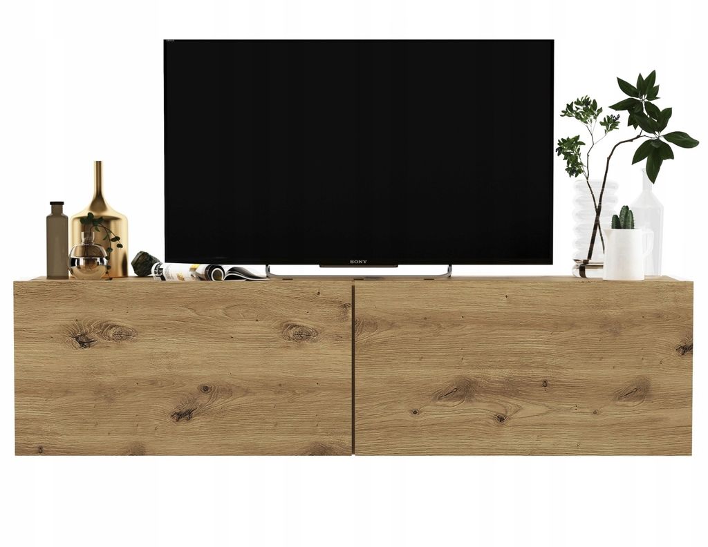 A modern TV stand with a large screen television on top, and decorative items on the surface.