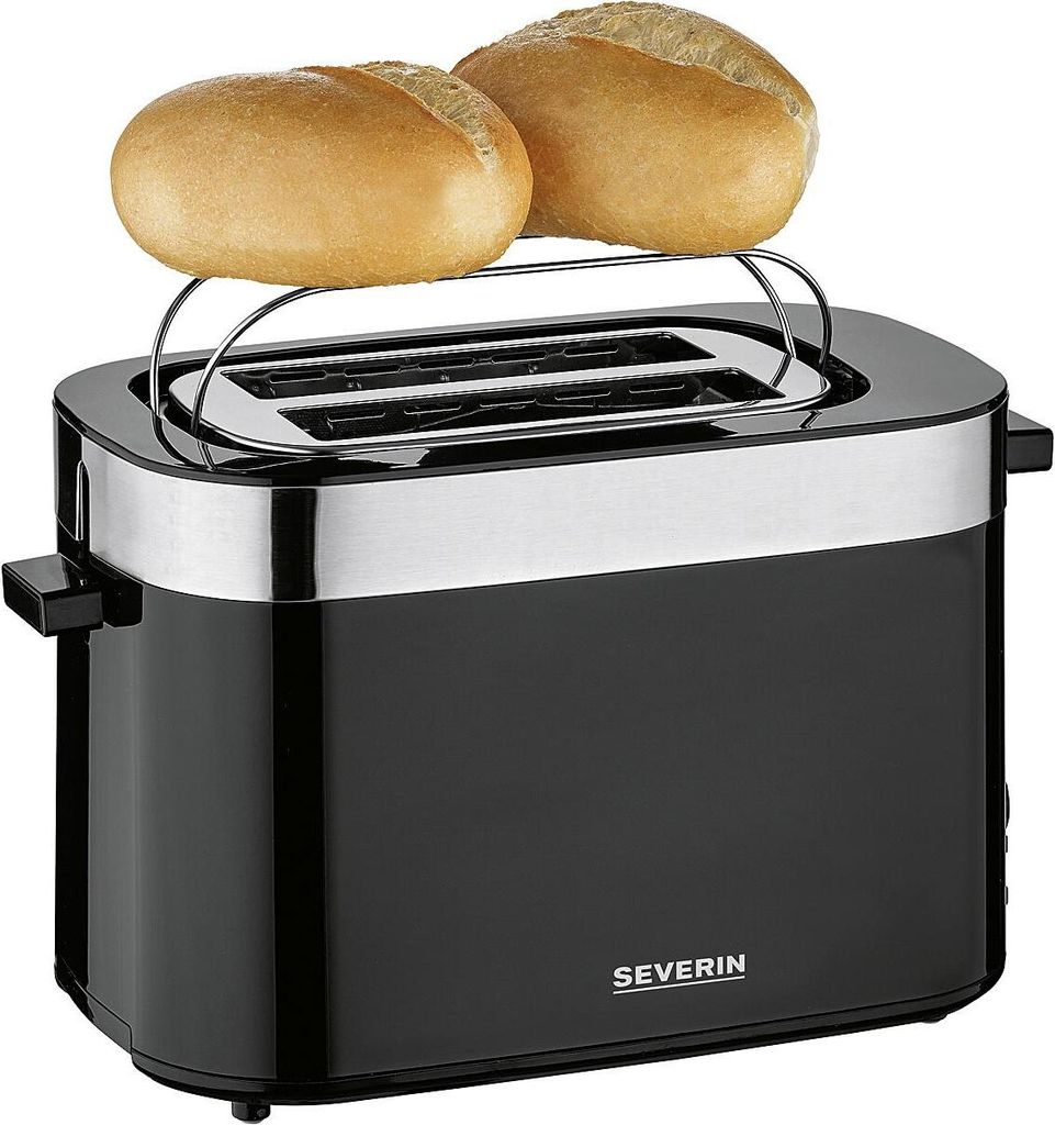 A black and silver toaster with two bread rolls on top.